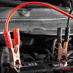 Red and black battery jump leads with storage case
