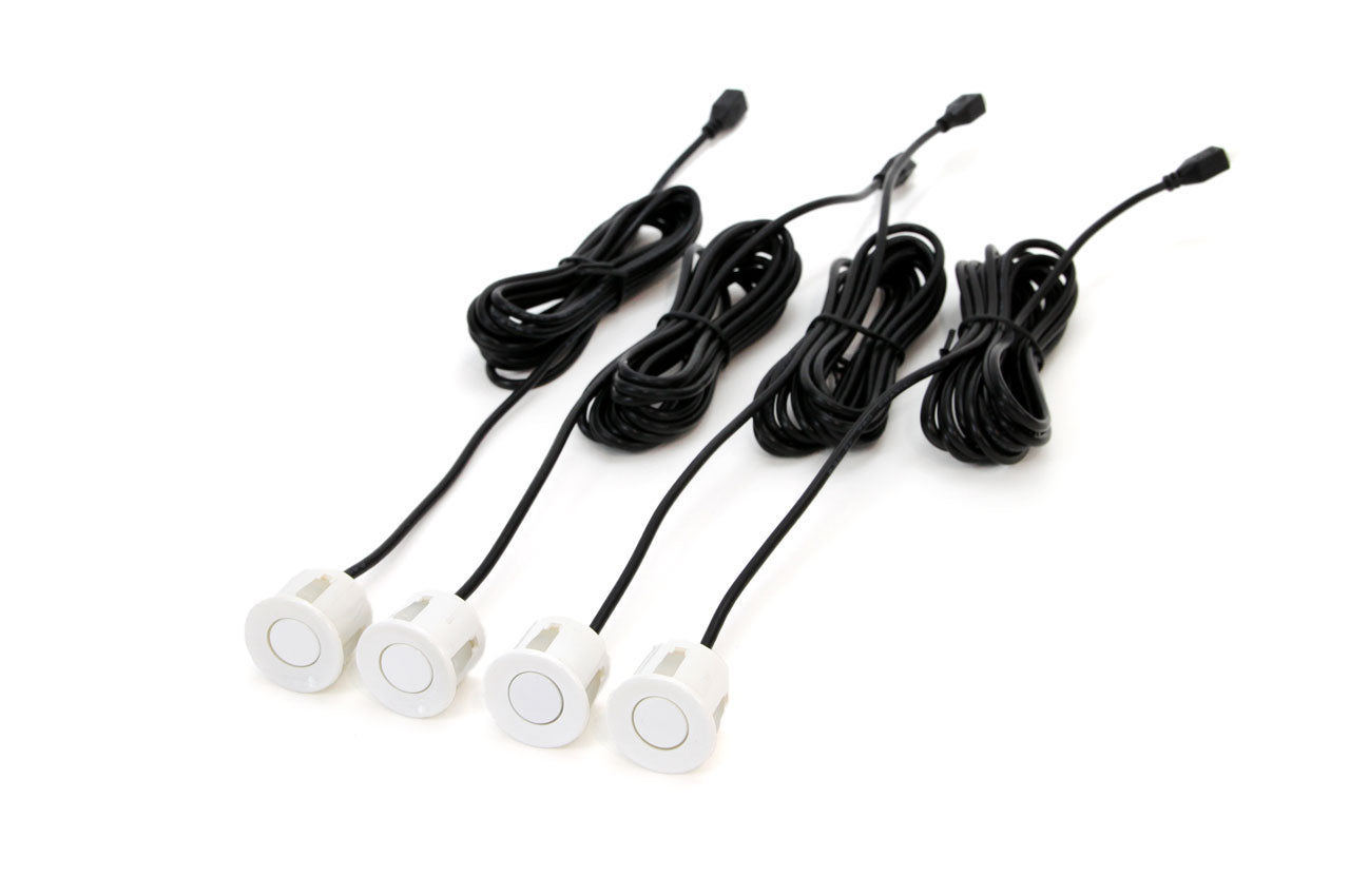 Four white parking sensors
